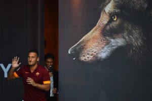 AS Roma French head coach Rudi Garcia (C) takes a picture of AS Roma midfielder and captain Francesco Totti (L) prior to a friendly football match between AS Roma and Fenerbahce, on August 19, 2014 at the Olympic stadium in Rome. AFP PHOTO / GABRIEL BOUYS (Photo credit should read GABRIEL BOUYS/AFP/Getty Images)