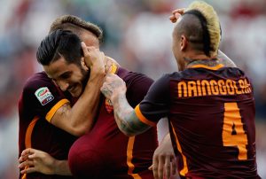 ROME, ITALY - SEPTEMBER 26: Kostas Manolas (C) of AS Roma celebrates with his teammates Lucas Digne (L) and Radja Nainngolan after scoring the opening goal during the Serie A match between AS Roma and Carpi FC at Stadio Olimpico on September 26, 2015 in Rome, Italy. (Photo by Paolo Bruno/Getty Images)